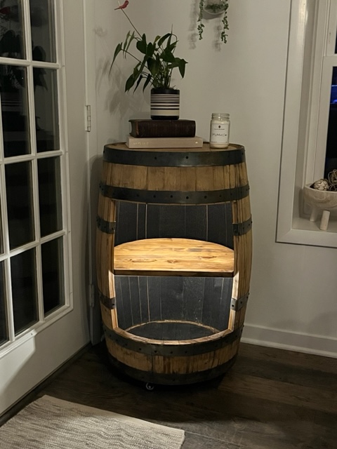 whiskey barrel bar lights on and empty